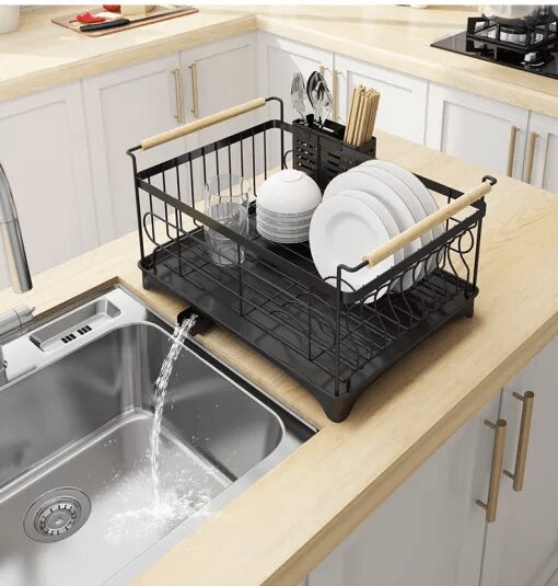 A kitchen with a sink and a window Description automatically generated