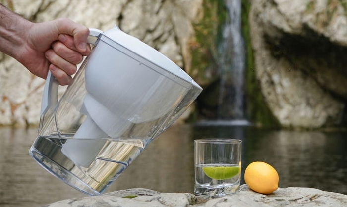 A picture containing person, water, table, food Description automatically generated